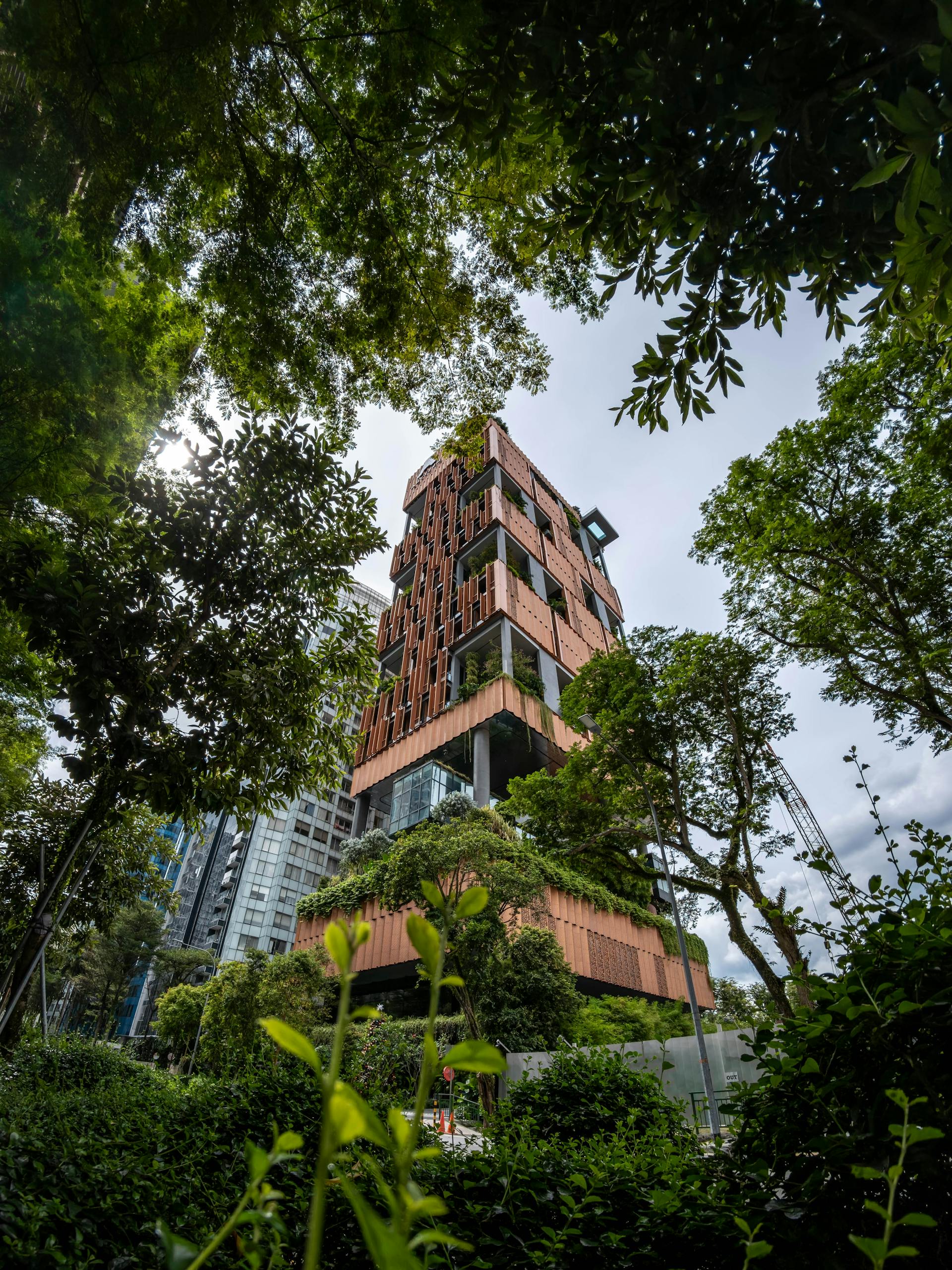 Contemporary architectural marvel nestled in lush greenery featuring a unique eco-friendly design.